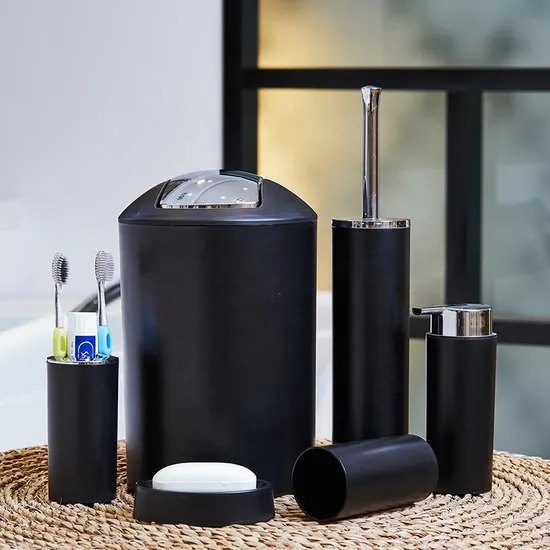 Black bathroom accessory set in a bathroom