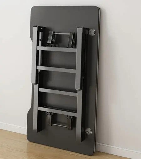 Foldable gaming table folded flat against a wall