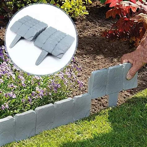Pushing a GardenTrim edging panel into the soil