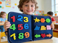 Child holding the Montessori felt learning board with numbers and shapes